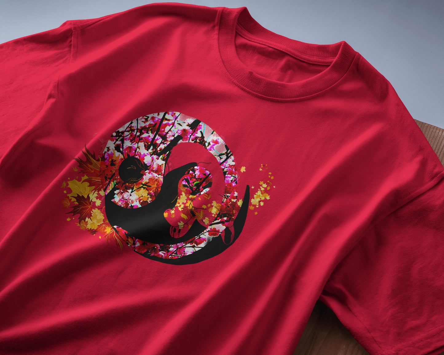 Soft Cardinal red color t-shirt featuring artistic yin yang symbol created with black and white cats in circular balance