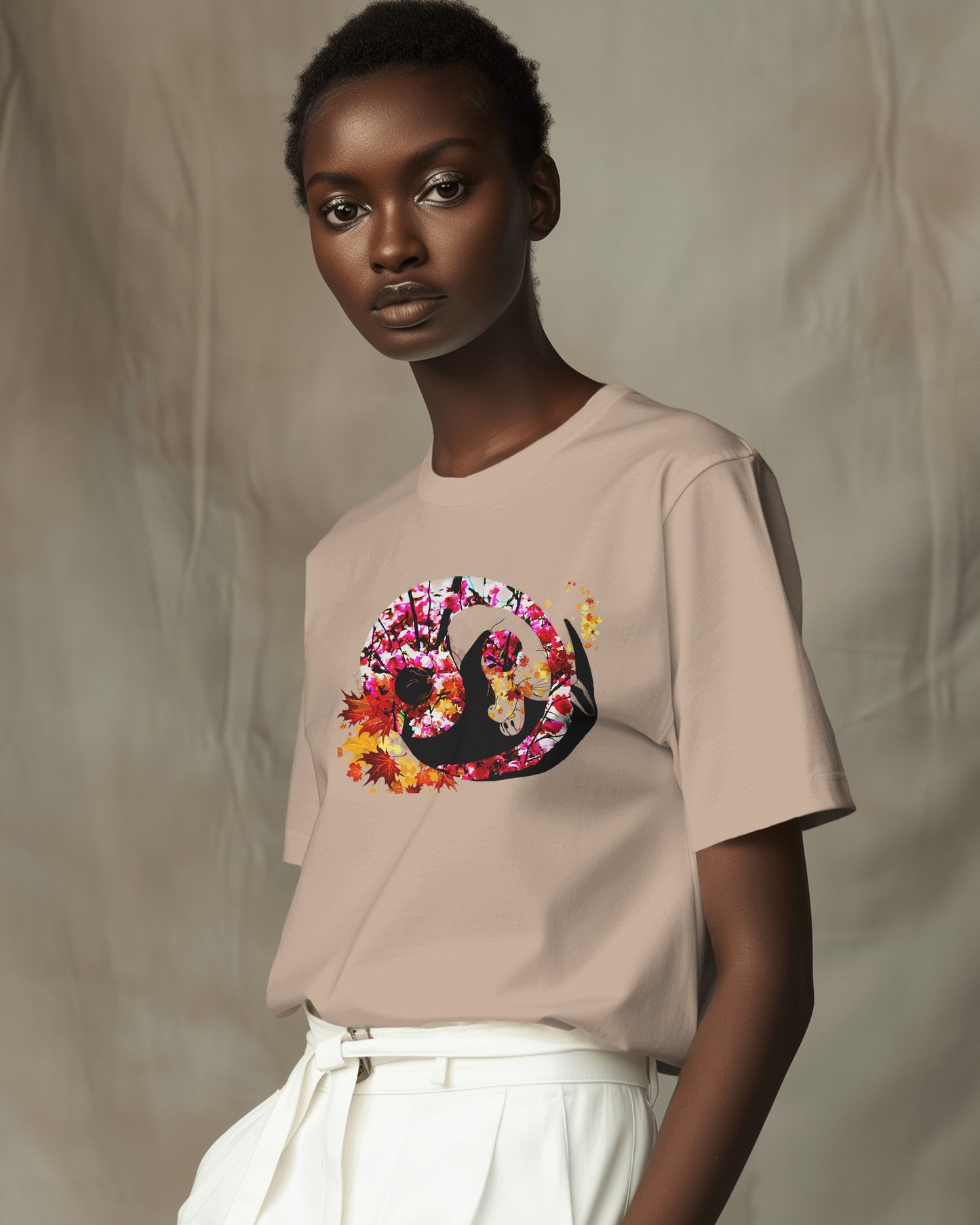 Soft Sand color t-shirt featuring artistic yin yang symbol created with black and white cats in circular balance