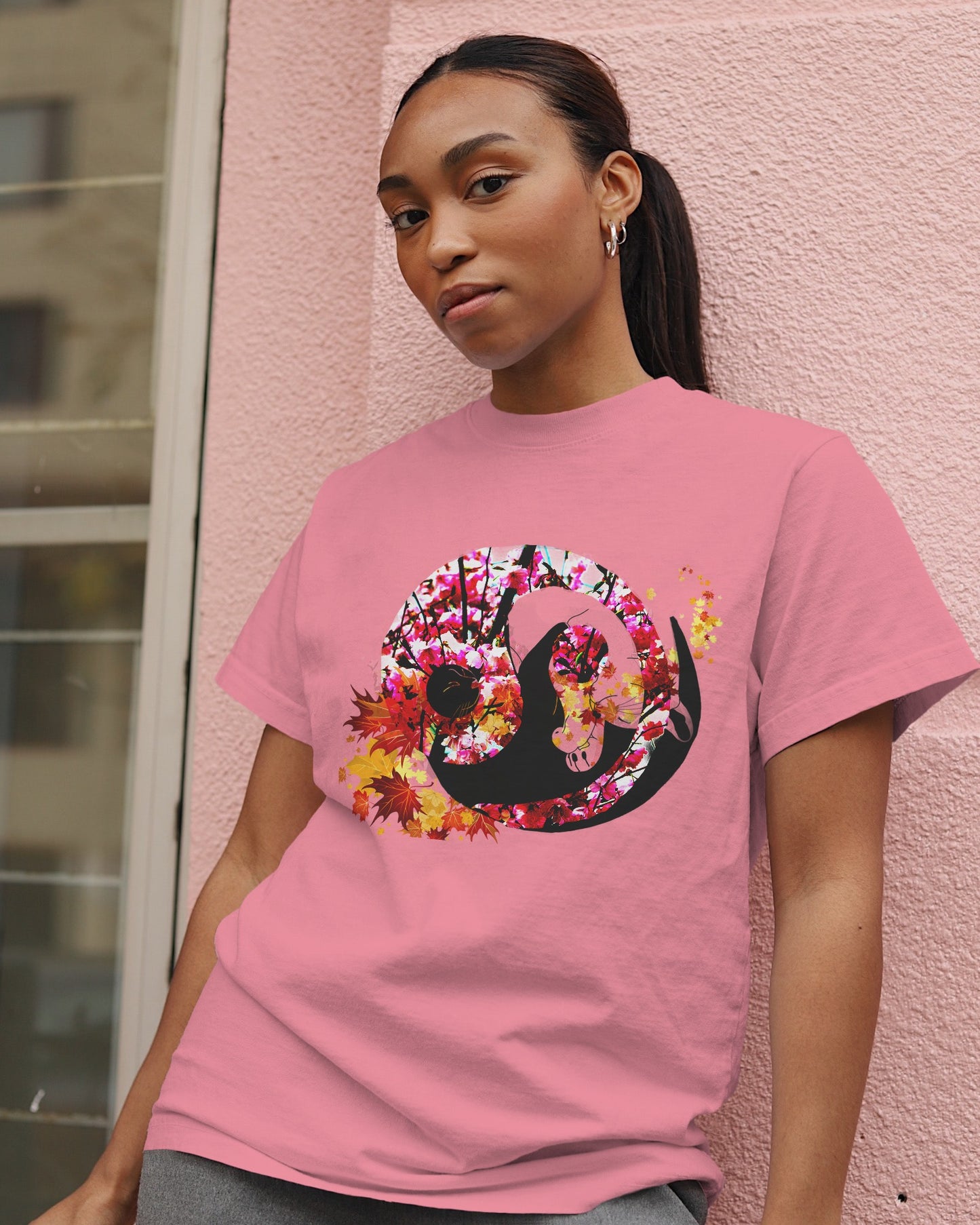 Soft Azalea pink color t-shirt featuring artistic yin yang symbol created with black and white cats in circular balance