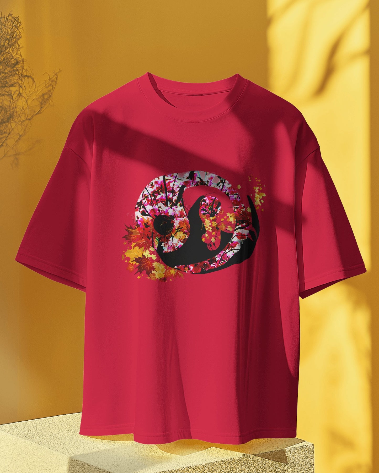 Soft Cardinal red color t-shirt featuring artistic yin yang symbol created with black and white cats in circular balance