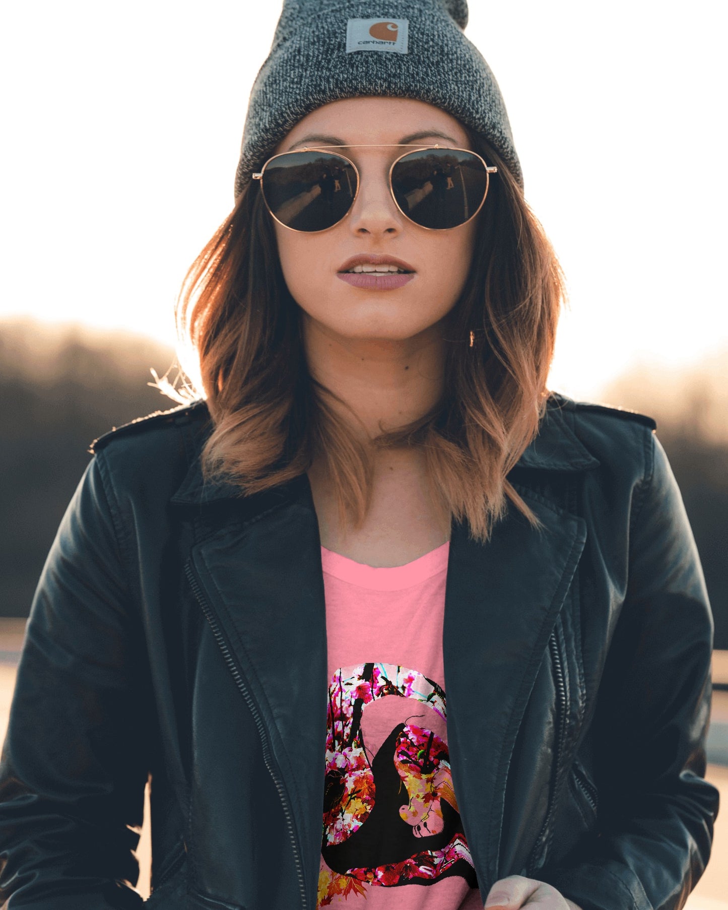Soft Azalea pink color t-shirt featuring artistic yin yang symbol created with black and white cats in circular balance