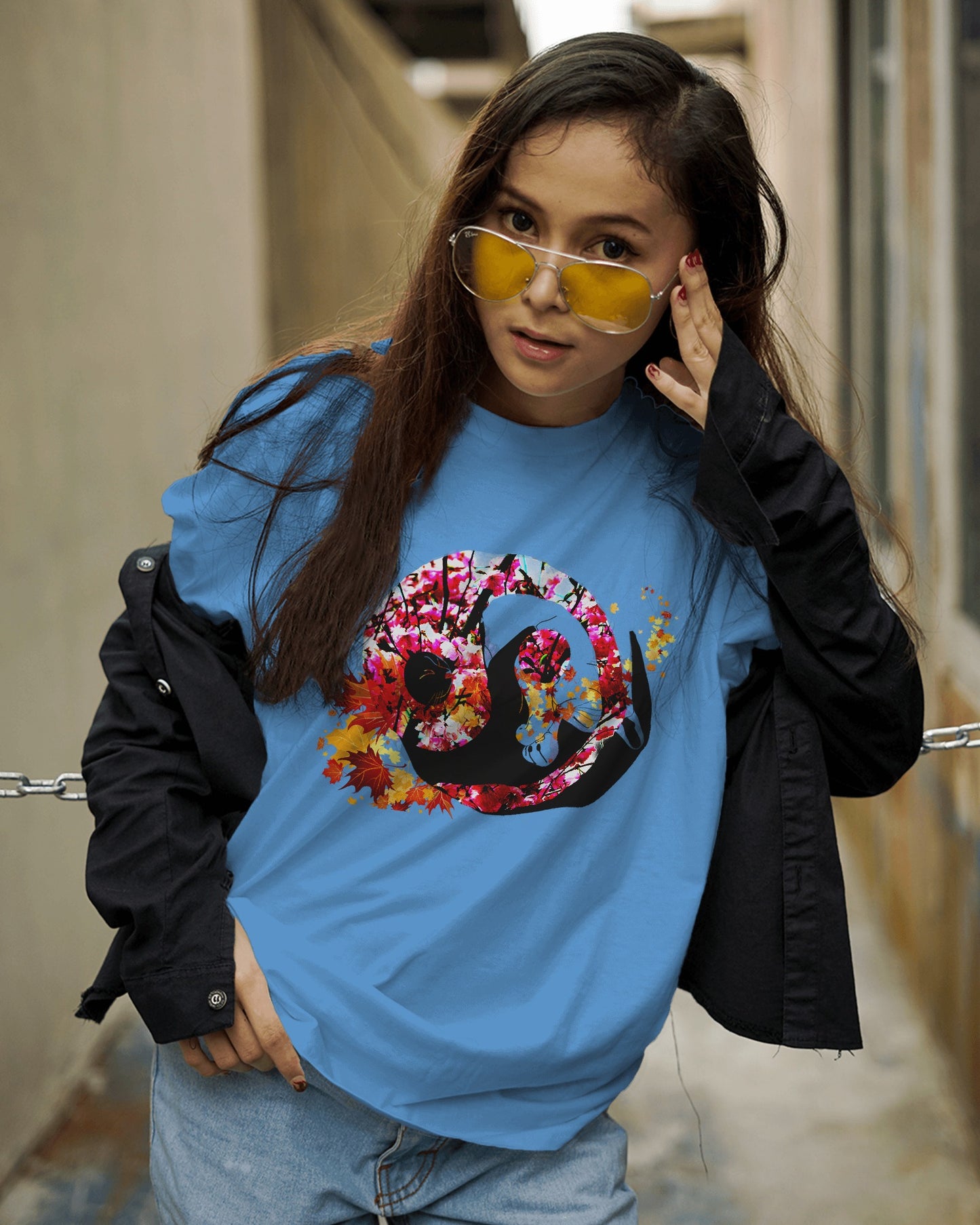 Soft Sky Blue color t-shirt featuring artistic yin yang symbol created with black and white cats in circular balance
