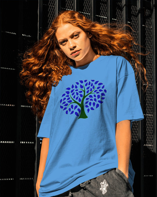 Sky Blue Organic cotton t-shirt with colorful tree of life artwork on blue fabric background