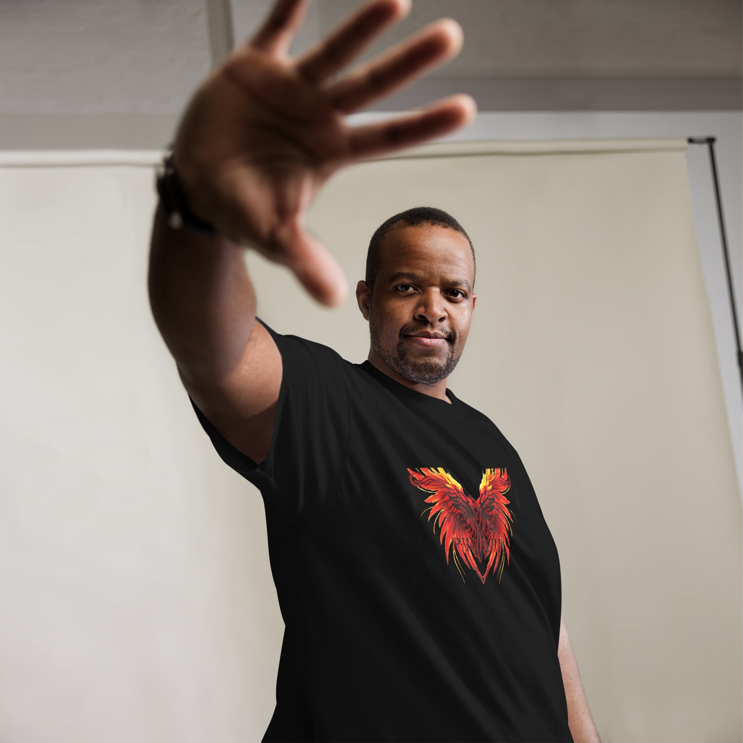 Black Phoenix t-shirt with red fiery immortal bird design on black cotton fabric