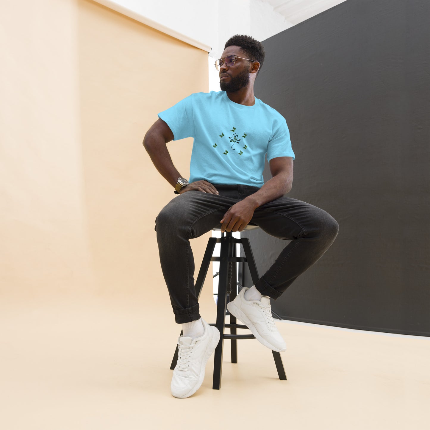 Eco-friendly organic cotton Sky Blue color t-shirt with green environmental design featuring leaf patterns and nature symbols