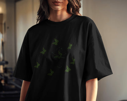 Eco-friendly organic cotton Black color t-shirt with green environmental design featuring leaf patterns and nature symbols
